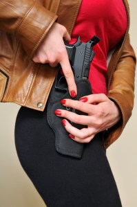Woman-Drawing-Gun-from-Holster